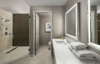 Guest bathroom with shower at Hilton Boston Logan Airport.