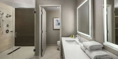 Guest bathroom with shower at Hilton Boston Logan Airport.