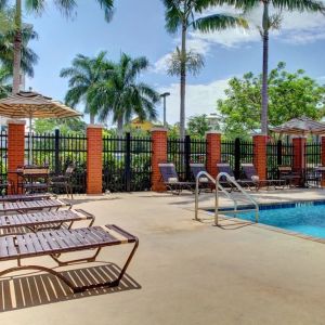 Sun loungers beside the pool at Hyatt PLACE Fort Lauderdale Airport - South & Cruise Port.