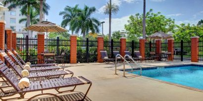 Sun loungers beside the pool at Hyatt PLACE Fort Lauderdale Airport - South & Cruise Port.