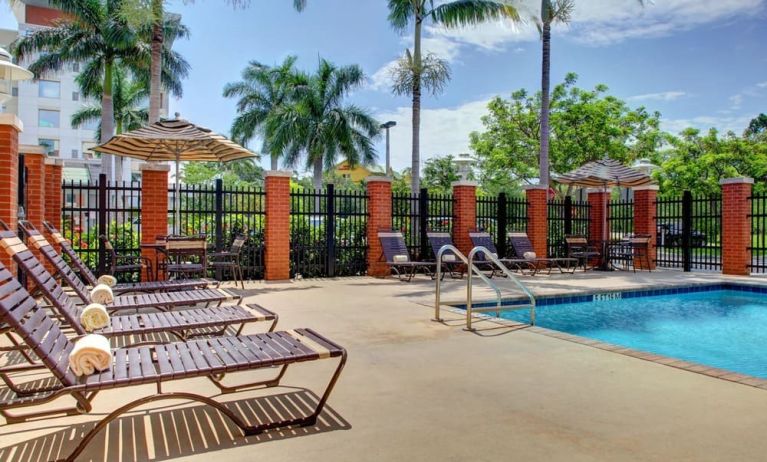 Sun loungers beside the pool at Hyatt PLACE Fort Lauderdale Airport - South & Cruise Port.