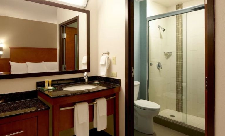 Guest bathroom with shower at Hyatt Place Chicago, Lombard / Oak Brook.