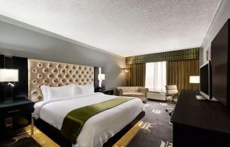 Delux king room with TV at Wyndham Garden Dallas North.