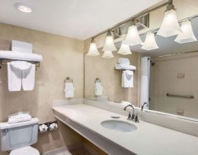 Guest bathroom with shower at Wyndham Garden Dallas North.