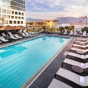 Relaxing outdoor pool with lounge chairs at the Fairmont Waterfront.