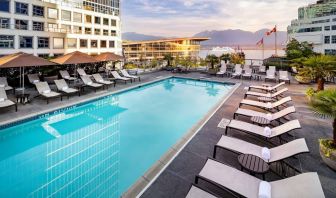 Relaxing outdoor pool with lounge chairs at the Fairmont Waterfront.