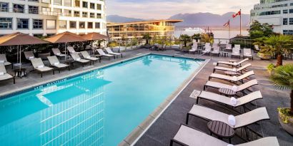 Relaxing outdoor pool with lounge chairs at the Fairmont Waterfront.