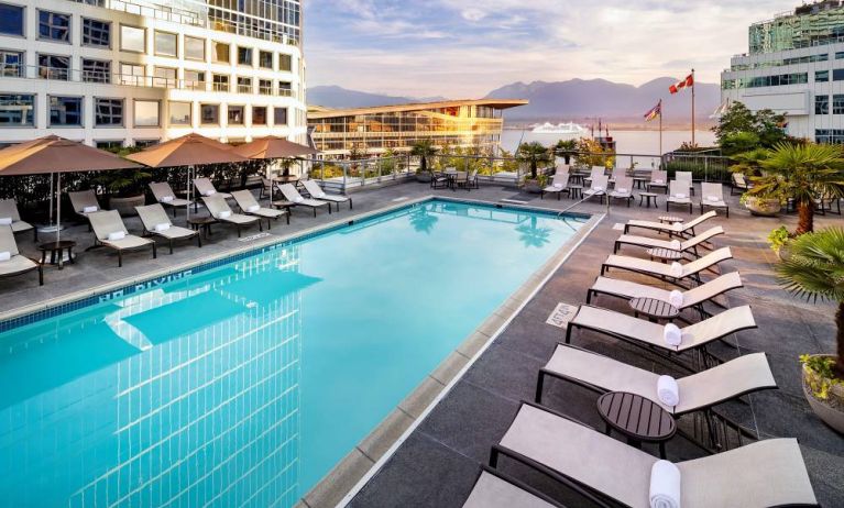 Relaxing outdoor pool with lounge chairs at the Fairmont Waterfront.