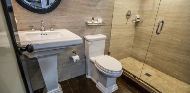 Guest bathroom with shower at Hotel Croydon.