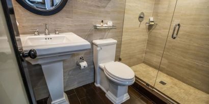 Guest bathroom with shower at Hotel Croydon.