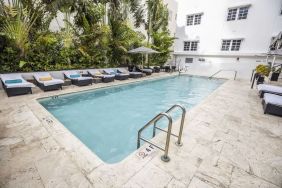 Relaxing pool area with sun loungers at Hotel Croydon.