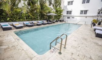 Relaxing pool area with sun loungers at Hotel Croydon.