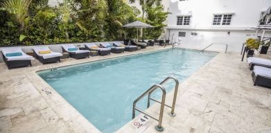 Relaxing pool area with sun loungers at Hotel Croydon.