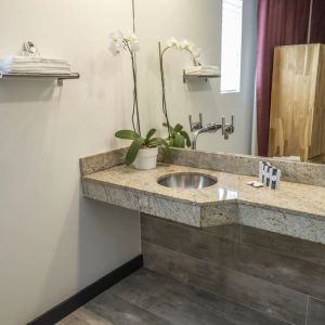 Guest bathroom with shower at Catalina Hotel & Beach Club.