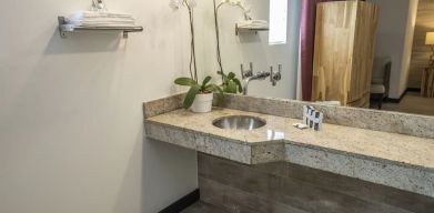 Guest bathroom with shower at Catalina Hotel & Beach Club.