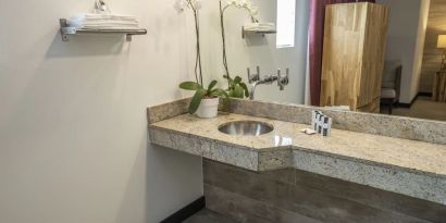 Guest bathroom with shower at Catalina Hotel & Beach Club.