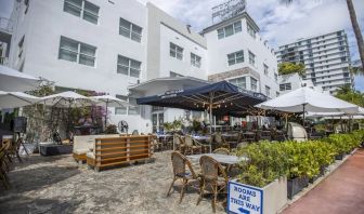 Comfortable outdoor tables and chairs with umbrellas ideal for coworking at Catalina Hotel & Beach Club.