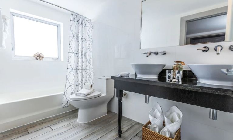 Private guest bathroom at Seaside All Suites Hotel.