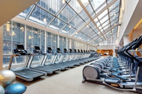 Large fitness center with treadmills at the New York Hilton Midtown.