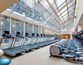 Large fitness center with treadmills at the New York Hilton Midtown.