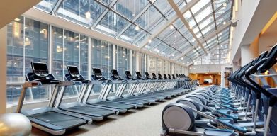 Large fitness center with treadmills at the New York Hilton Midtown.