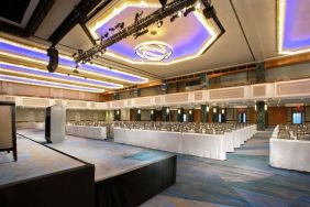 Meeting room with comfortable chairs and TV screen at the New York Hilton Midtown.