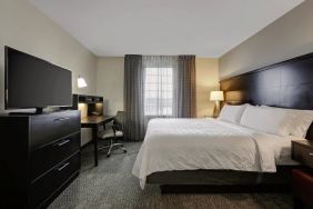 King bed with TV at Staybridge Suites Washington D.C.- Greenbelt.