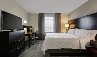 King bed with TV at Staybridge Suites Washington D.C.- Greenbelt.