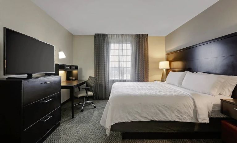 King bed with TV at Staybridge Suites Washington D.C.- Greenbelt.