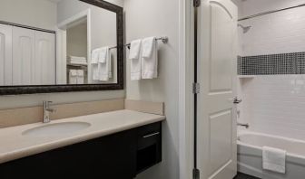 Private guest bathroom with shower and bath combo at Staybridge Suites Washington D.C.- Greenbelt.