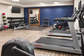 The Hampton Inn Chicago O`Hare’s fitness center includes a range of exercise machines and weights.