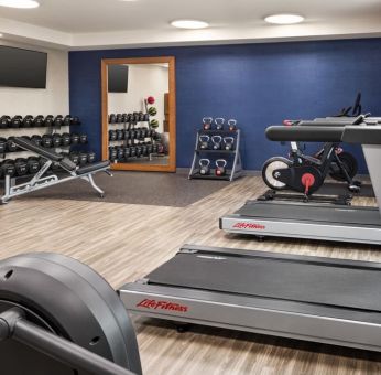 The Hampton Inn Chicago O`Hare’s fitness center includes a range of exercise machines and weights.