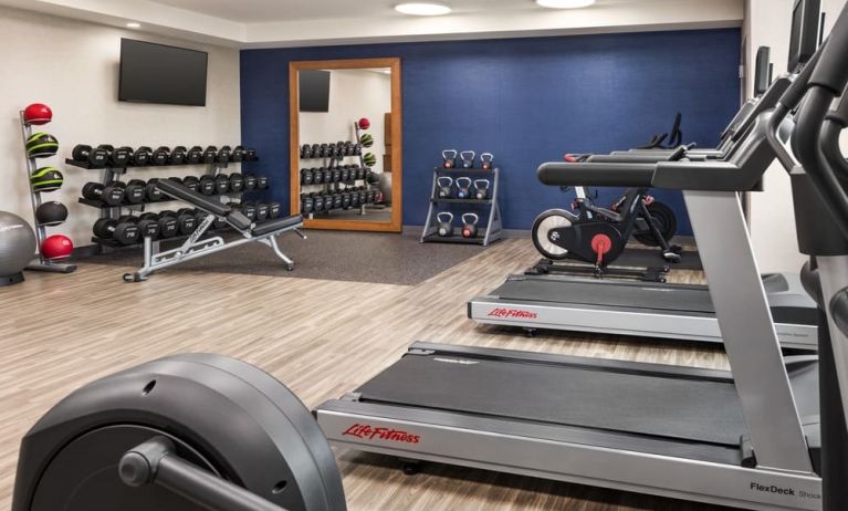 The Hampton Inn Chicago O`Hare’s fitness center includes a range of exercise machines and weights.