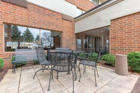 Outdoor terrace with seating at Holiday Inn Express Chicago - Downers Grove.