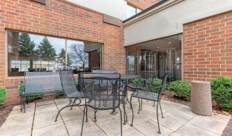 Outdoor terrace with seating at Holiday Inn Express Chicago - Downers Grove.