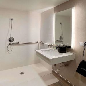 Guest bathroom with shower at Sleep Inn Oakbrook Terrace.