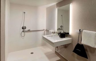 Guest bathroom with shower at Sleep Inn Oakbrook Terrace.