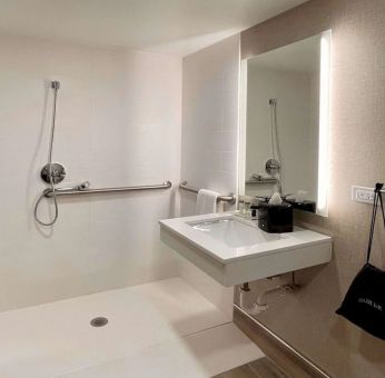 Guest bathroom with shower at Sleep Inn Oakbrook Terrace.