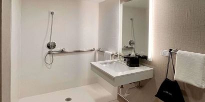 Guest bathroom with shower at Sleep Inn Oakbrook Terrace.