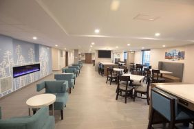 Dining area and coworking space at Sleep Inn Oakbrook Terrace.