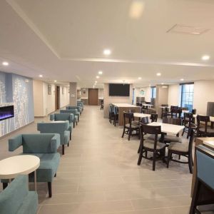 Dining area and coworking space at Sleep Inn Oakbrook Terrace.