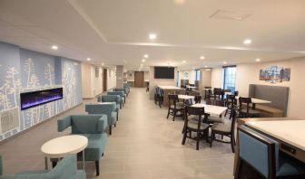 Dining area and coworking space at Sleep Inn Oakbrook Terrace.