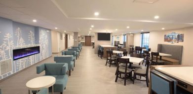 Dining area and coworking space at Sleep Inn Oakbrook Terrace.