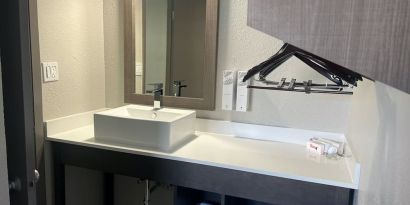 Private guest bathroom at Red Roof Plus Bourbonnais.