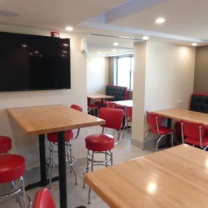 Dining and coworking space at Red Roof Plus Bourbonnais.