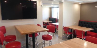 Dining and coworking space at Red Roof Plus Bourbonnais.