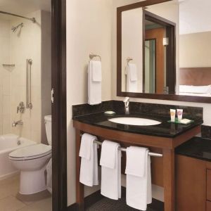 Guest bathroom with shower and tub at Hyatt Place Chicago/Hoffman Estates.