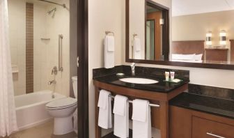 Guest bathroom with shower and tub at Hyatt Place Chicago/Hoffman Estates.