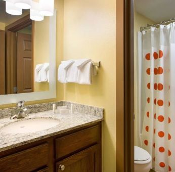 Private guest bathroom with shower at Sonesta Simply Suites Phoenix Scottsdale.