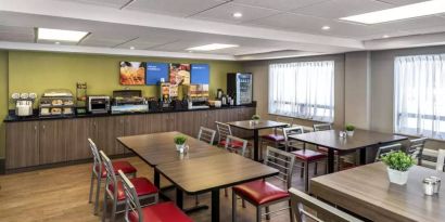 Comfort Inn Truro’s breakfast area has both standard and tall chairs, and a range of culinary options.